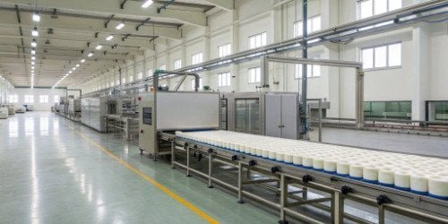 A modern PU continuous foaming production line in a clean factory setting