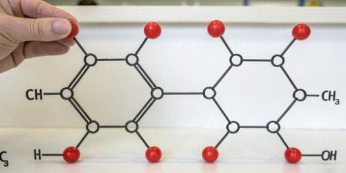 A simple chemical diagram showing a TDI molecule and a Polyol molecule connecting to form a Polyurethane chain.