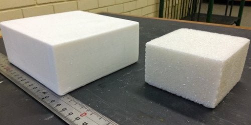 An image comparing a solid block of plastic to a block of PU foam of the same size, with a scale showing the foam is much lighter