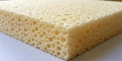 A close-up shot showing the fine, dense cell structure of high-density PU foam