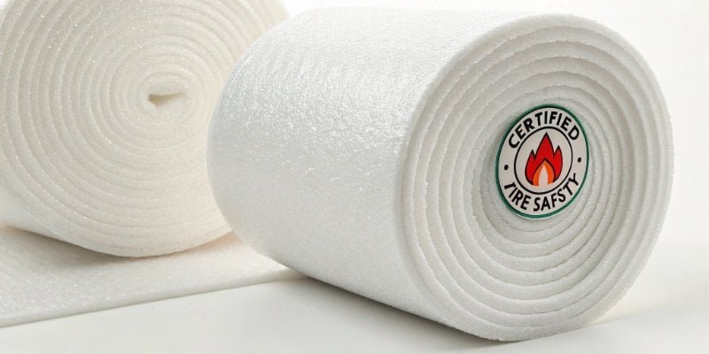 Fire Safety Certified PU Foam A certified fire safety label on a roll of PU foam material.